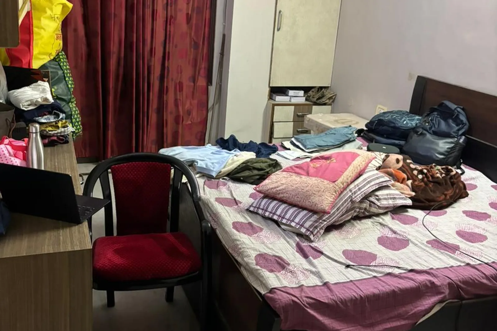 A bedroom photographed before staging, original photo before virtual staging