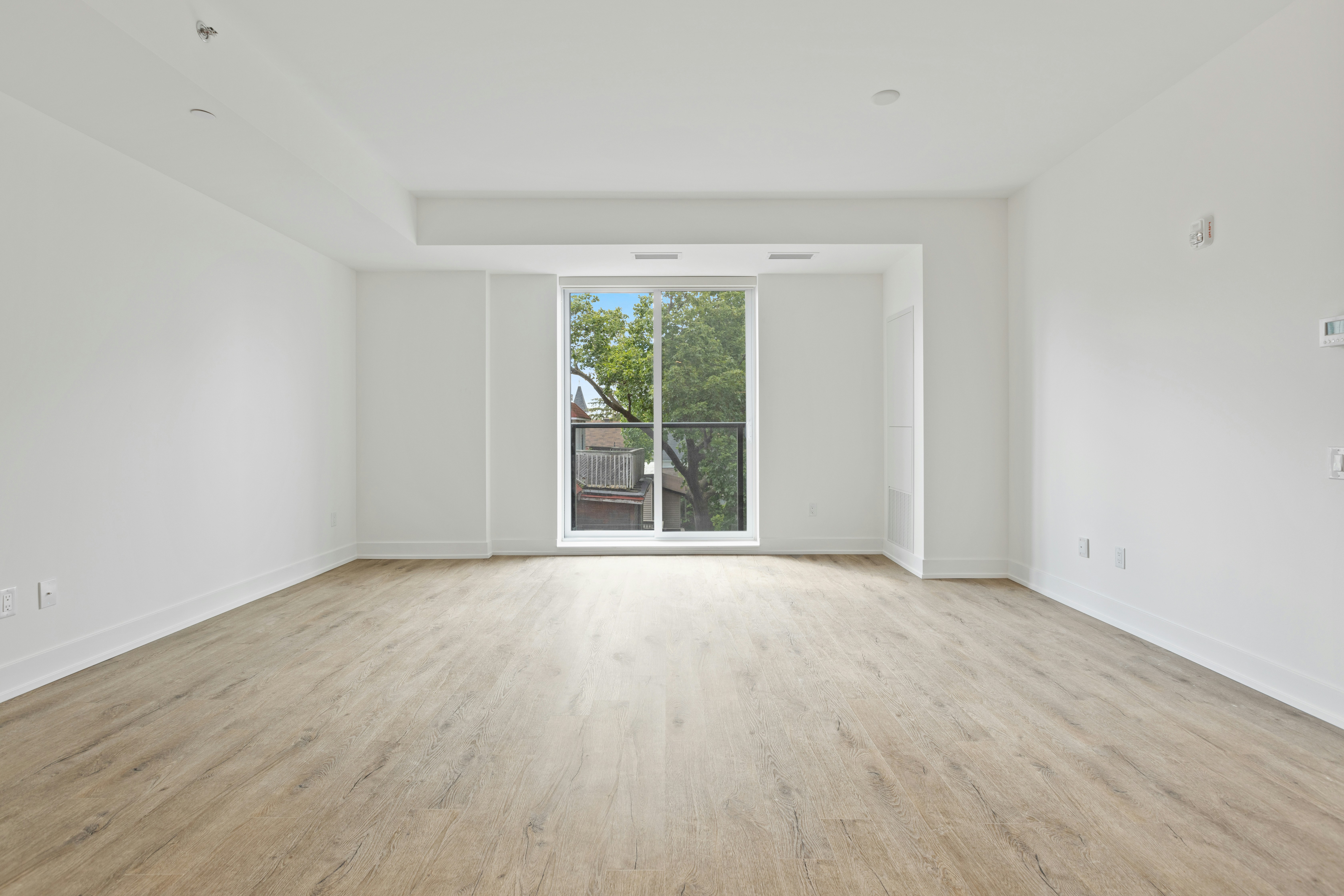 An empty living room before virtual staging